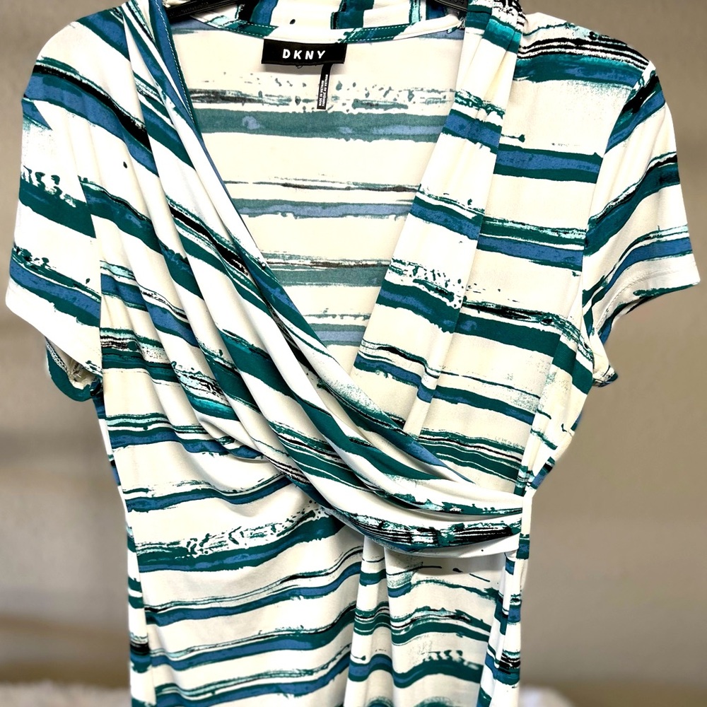White blouse with black green blue design